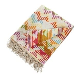 An Amara Wishlist colorful throw with fringes on a white background.