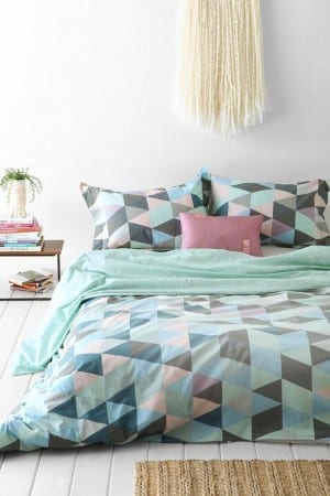 A stylish bed with a geometric pattern, perfect for a tween bedroom makeover.