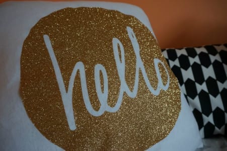 A Creative Cushion with the word hello on it.