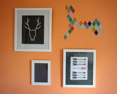 A room with framed pictures and arrows on the wall, showcasing exquisite eframes.