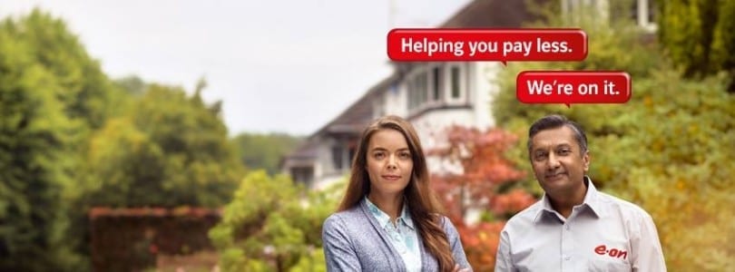 A man and a woman standing in front of a house, excited to WIN £150 High Street Vouchers from E.ON.