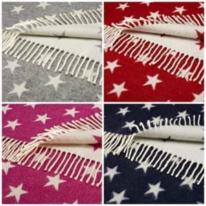 Four different colored star-shaped merino wool throws with fringes, worth £99 each.