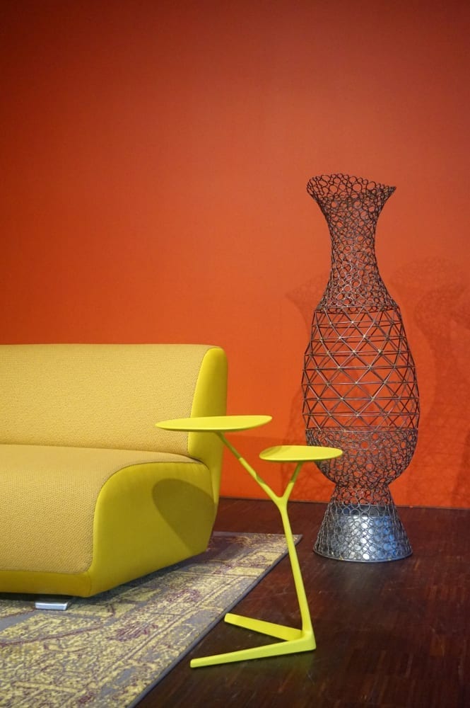 A yellow couch with a yellow vase in front of it, submitted for the Design Contest hosted by Connect Limburg.