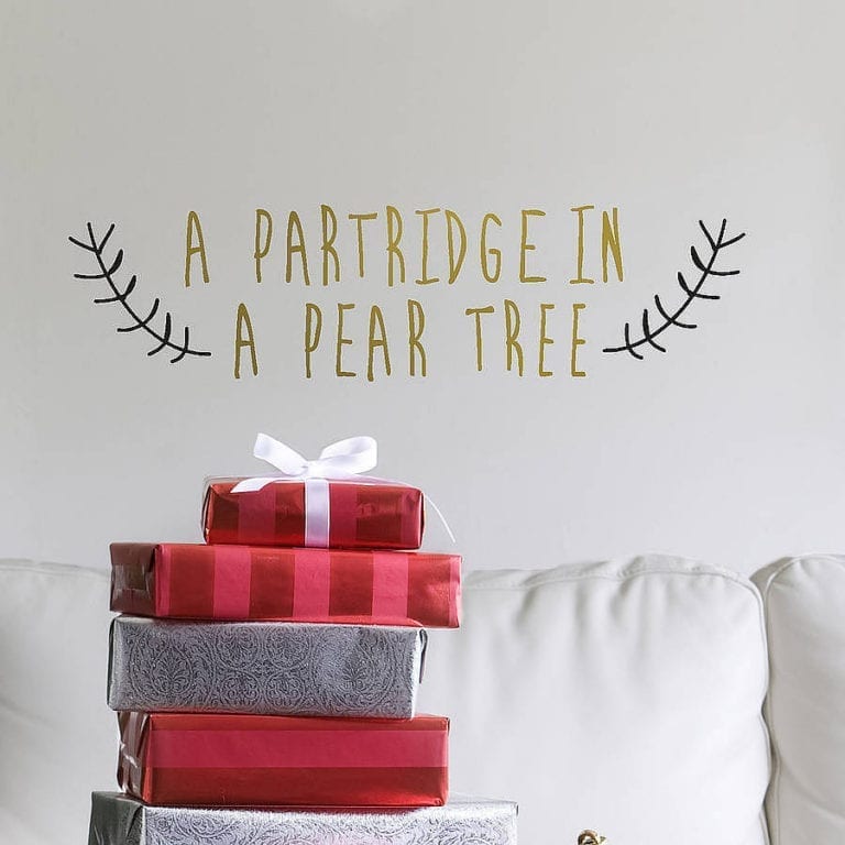 A themed Christmas partridge in a pear tree wall decal for a playroom.