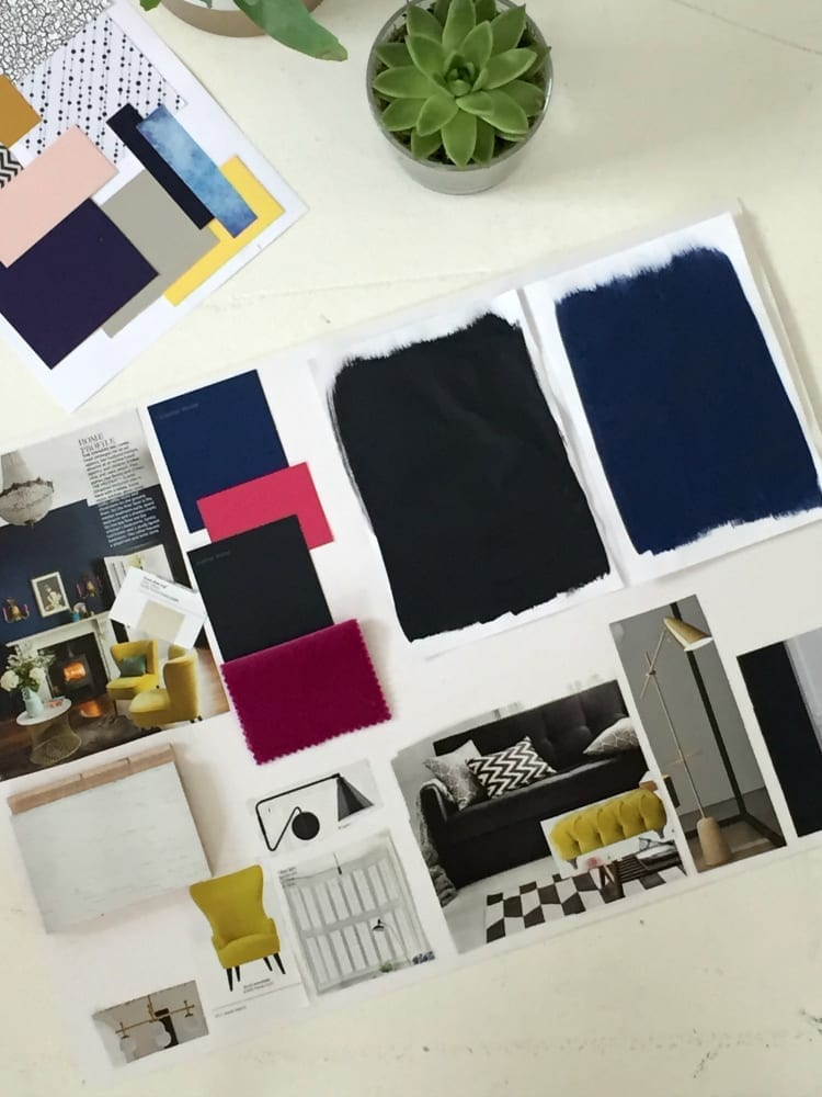 An interior design workshop featuring a vibrant blue and yellow color palette displayed on a table.