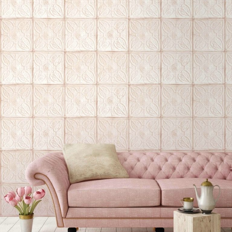 A living room transformed into a pink paradise, featuring a stunning pink couch and complementing pink wallpaper, all as part of a decorating project.