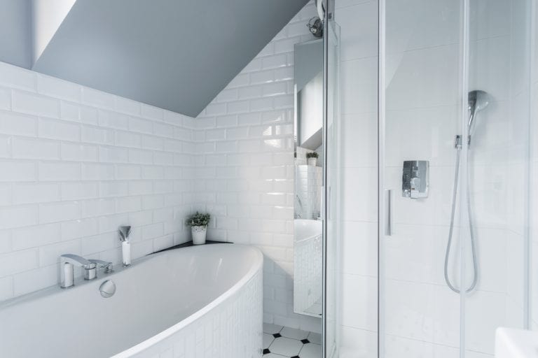 A luxury finish bathroom with a bathtub and shower.