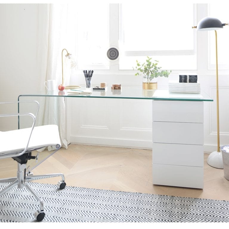 A white desk and chair in a contemporary home office.