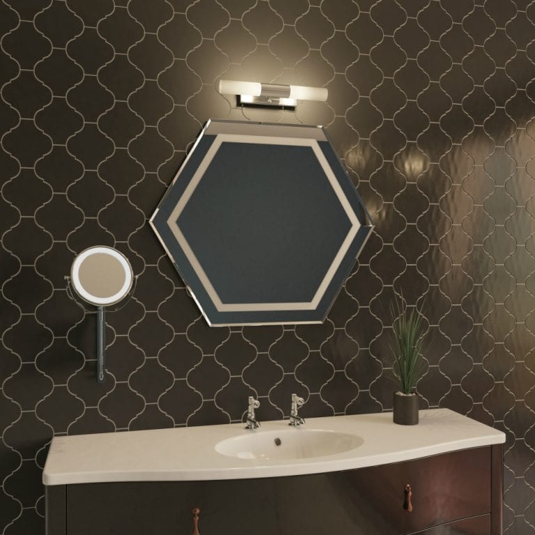 A glamorous bathroom with a mirror and a sink from soak.com.