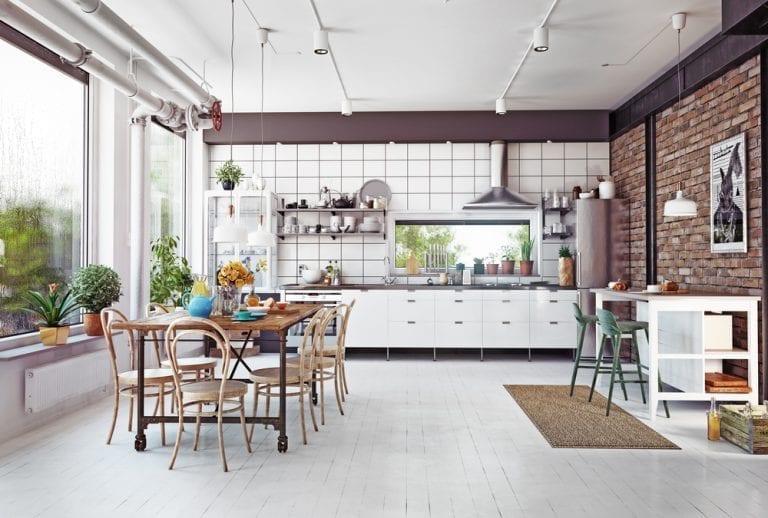 The perfect kitchen with brick walls and wooden floors, carefully planned.