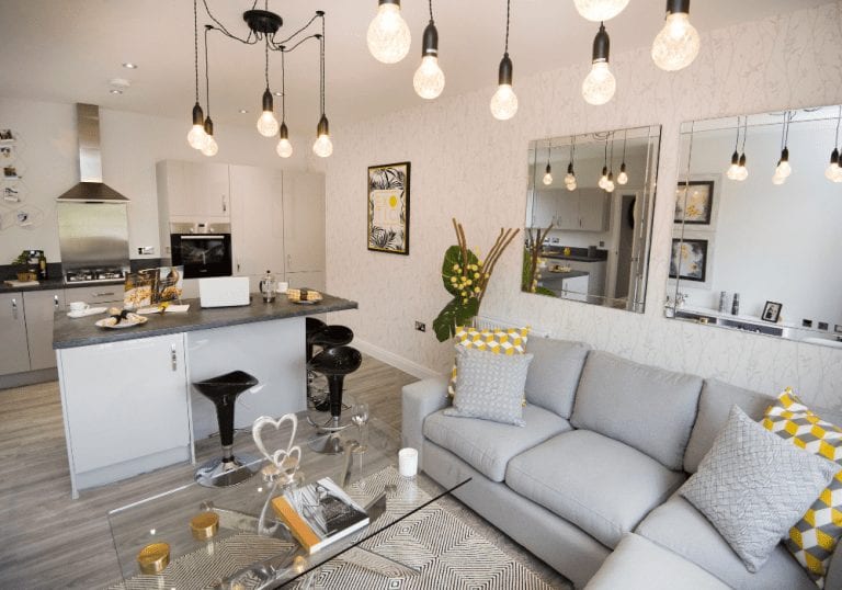 Buying a new build home with a modern living room and kitchen.