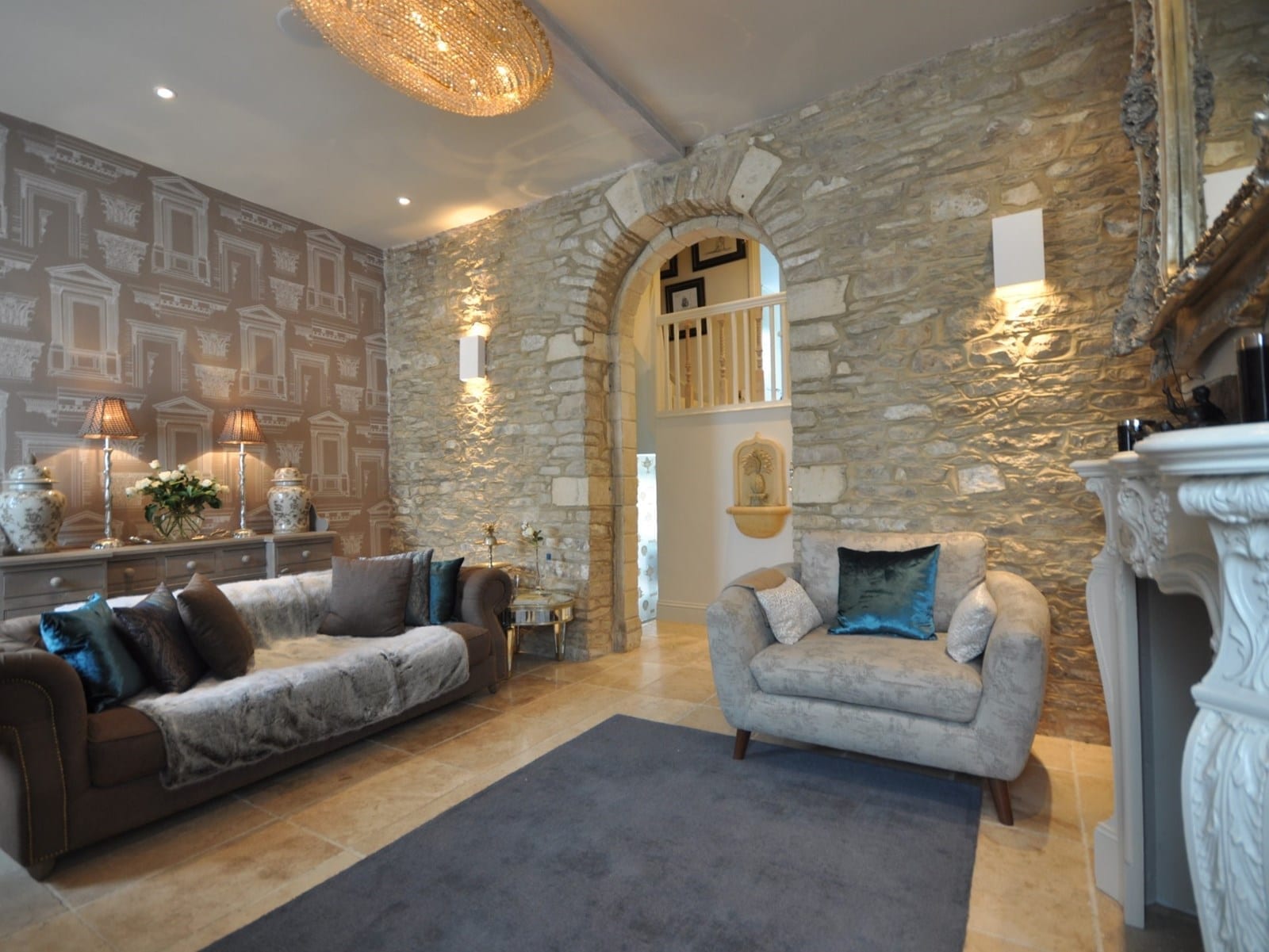 A stone wall in a living room at a Perfect Holiday Home.