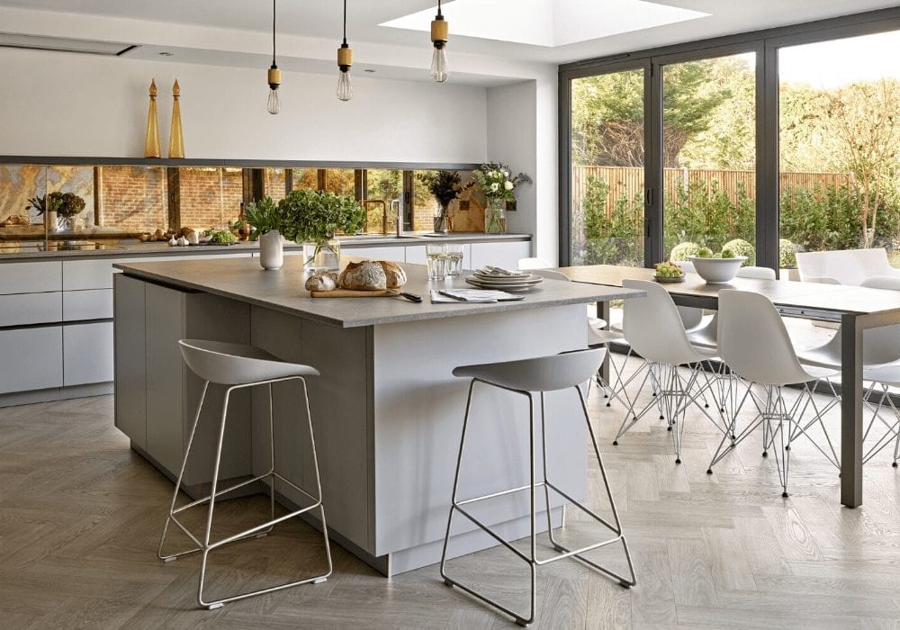 A modern kitchen with a large island, perfect for home improvement and following 2020 trends.