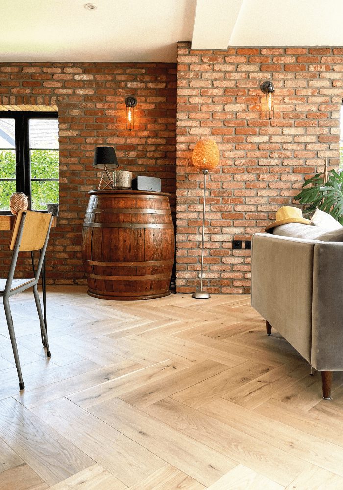 An exposed brick wall in a living room made with interior brick slips