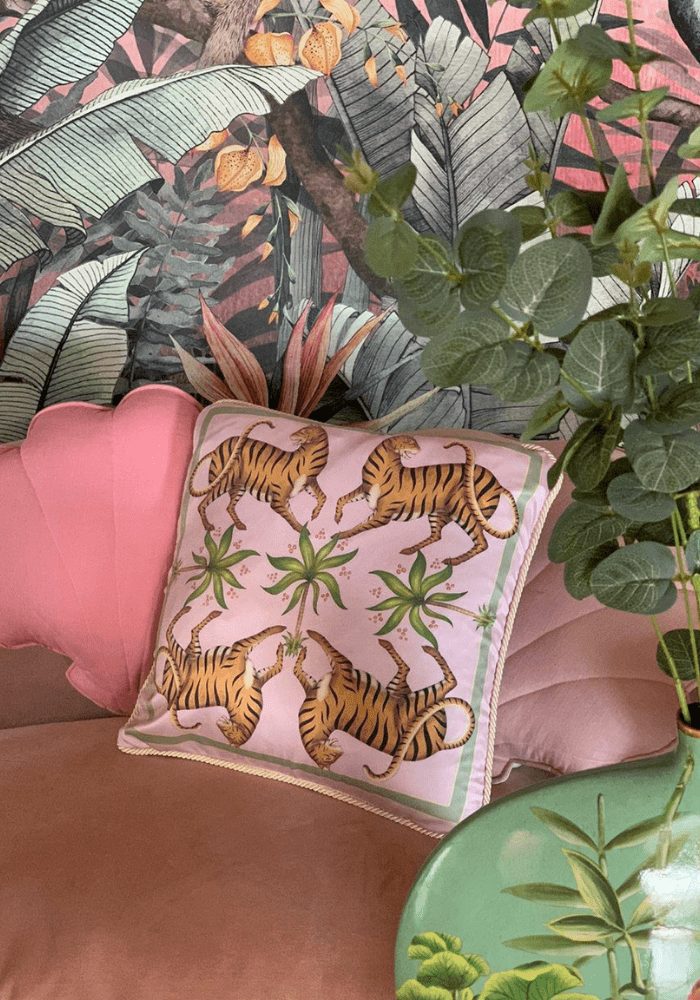 silk cushion fabric trend on a chair with jungle wallpaper