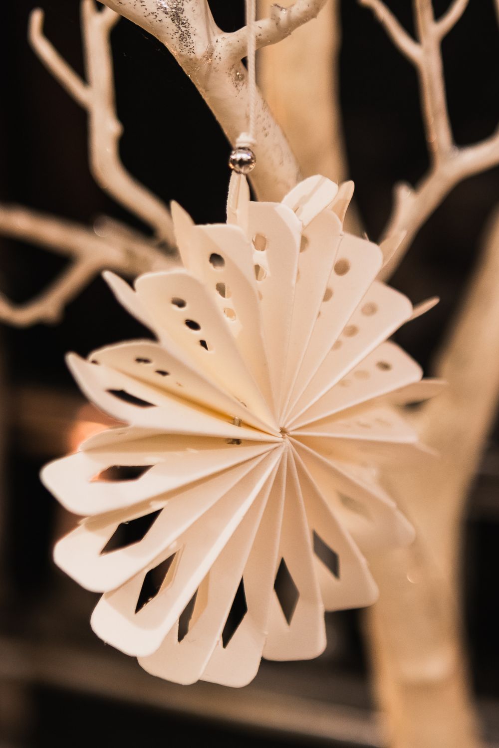 Hanging paper snowflake which can be used to make a small Christmas tree in a small home