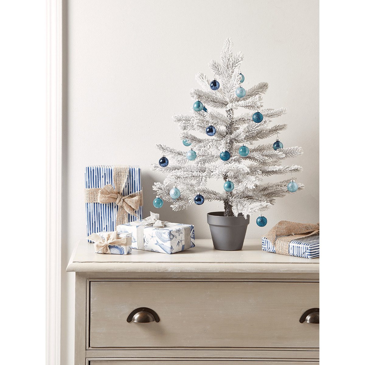 Tiny, white snowy Christmas tree perfect for a small home