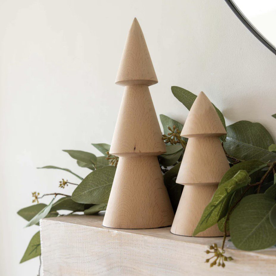 Wooden small Christmas tree on a mantlepiece