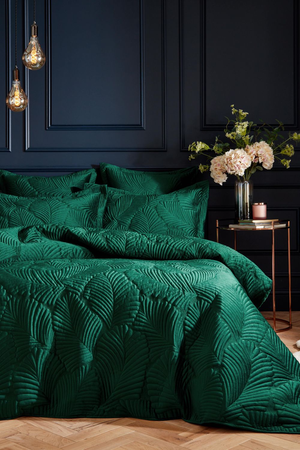 Luxury emerald green duvet cover in a professionally designed bedroom.