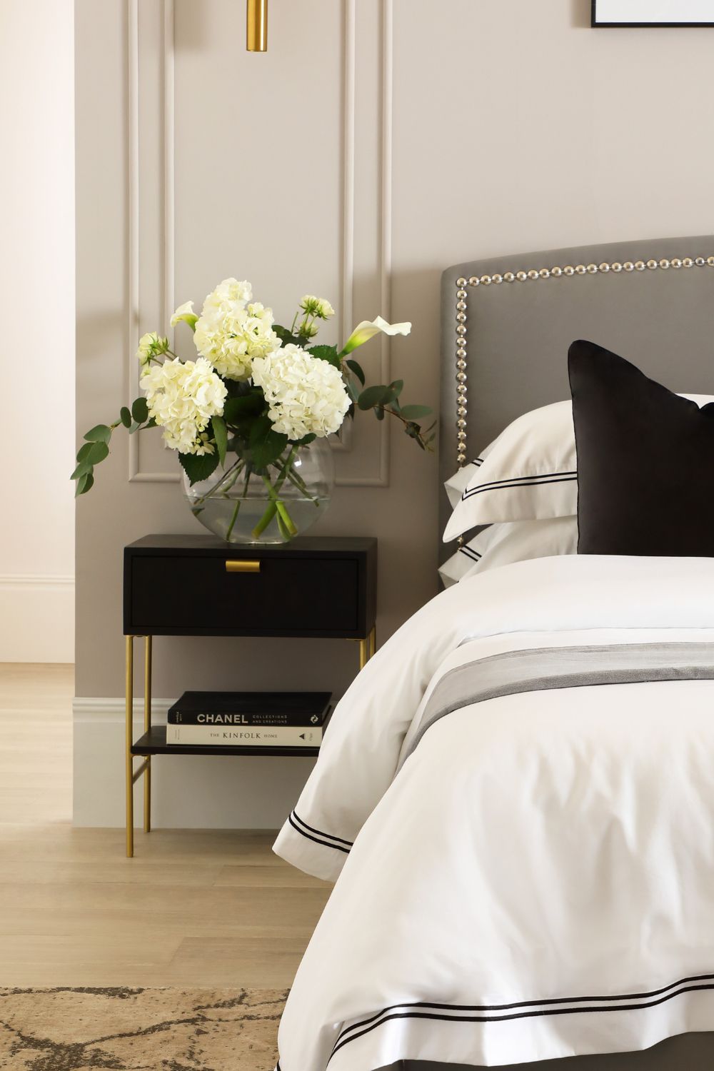 Designing a luxury bedroom with a bed and a nightstand.