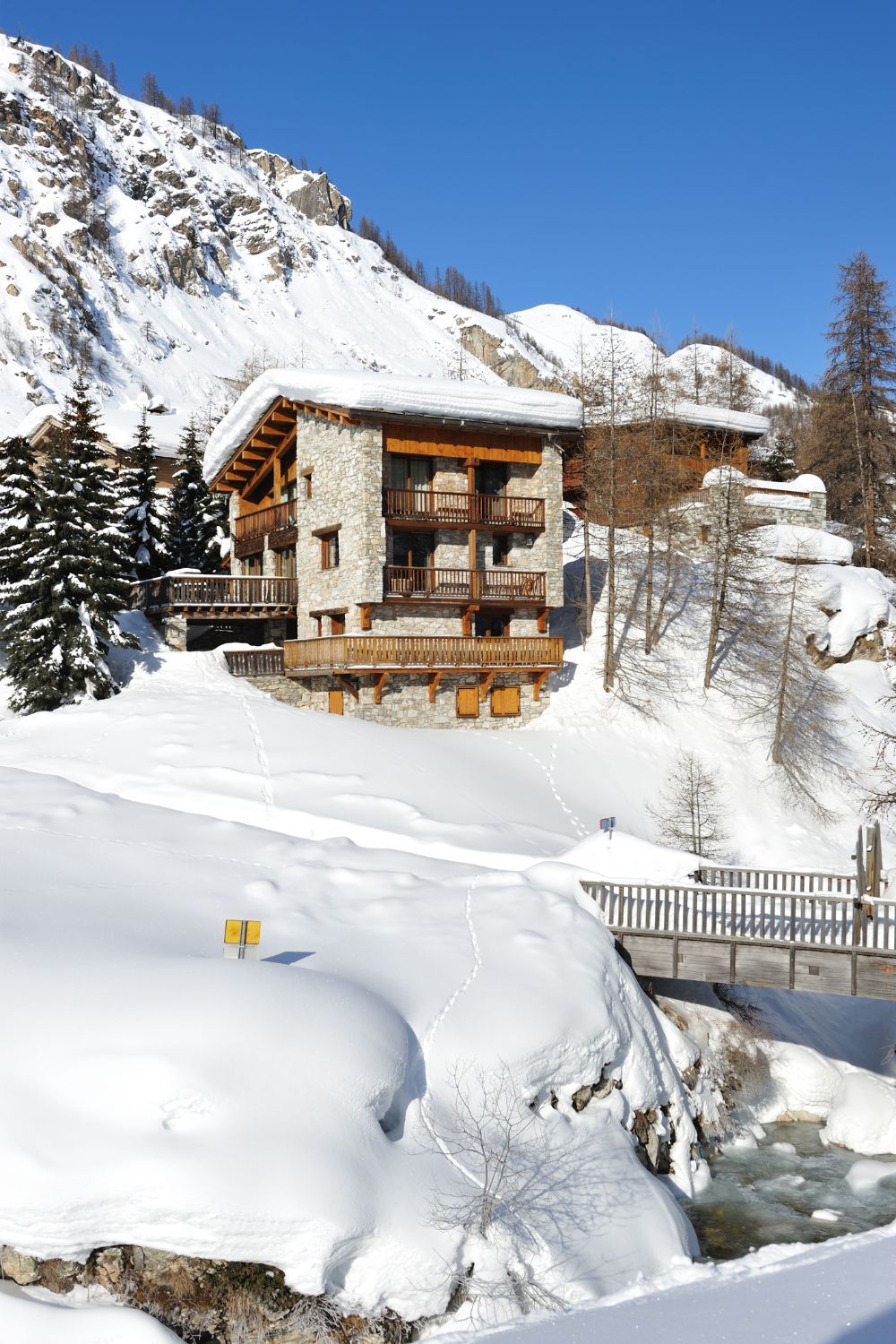 A luxurious ski chalet nestled on a snow-covered mountain in Europe.