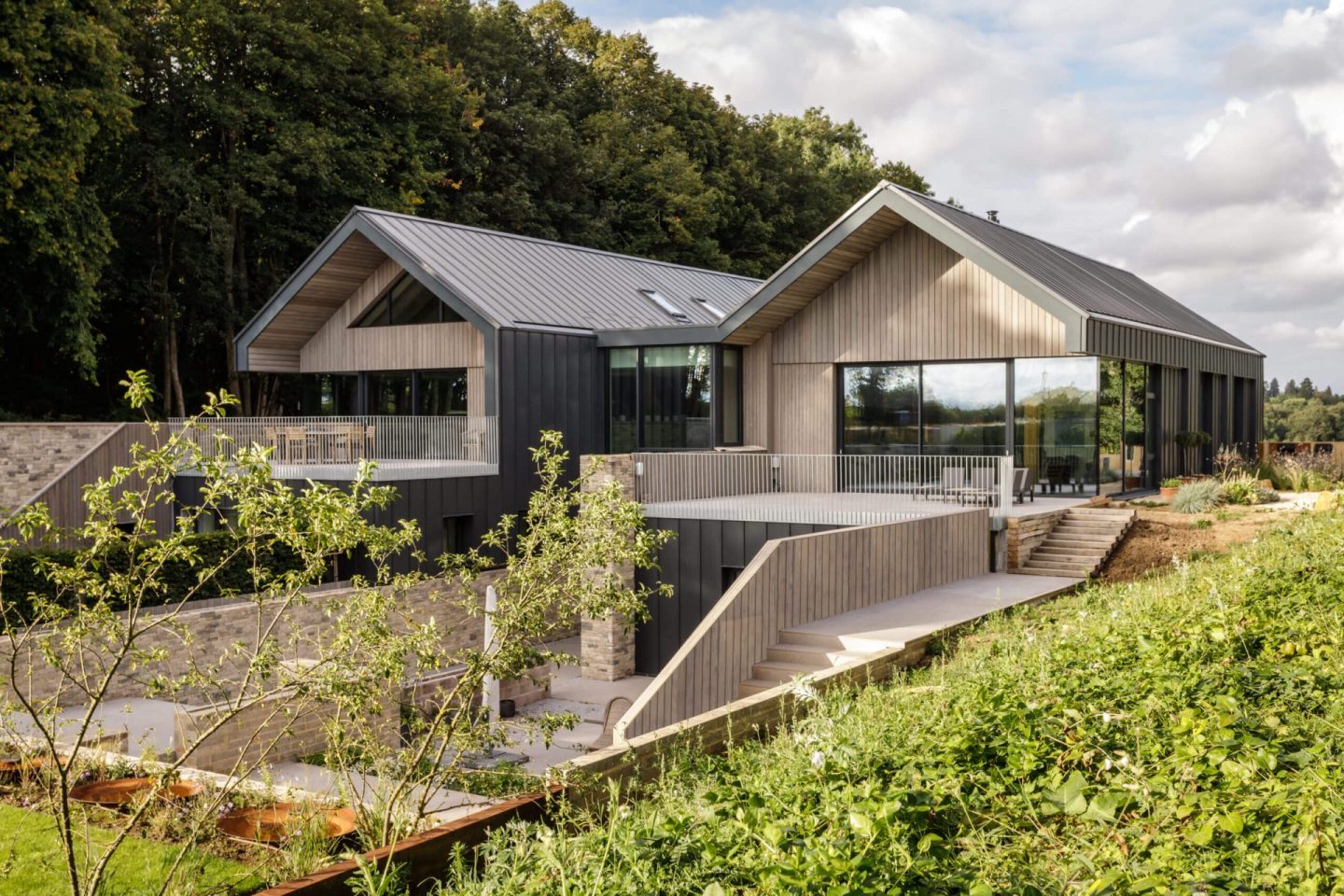 A modern house with noise-cancelling windows in a wooded area, offering numerous benefits.
