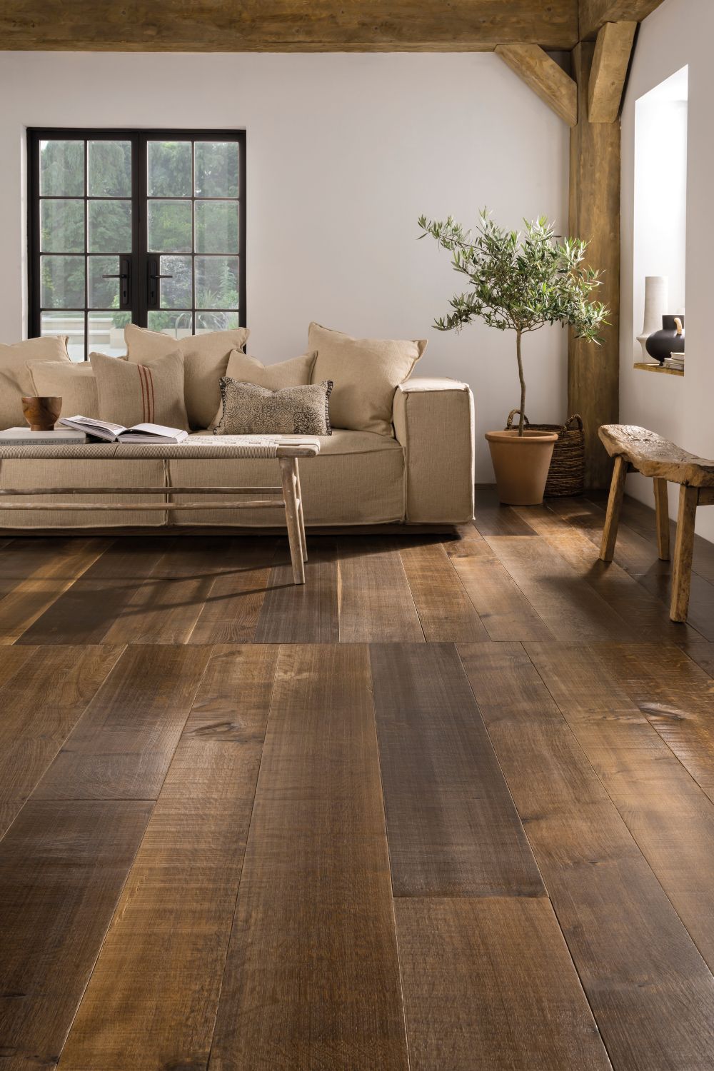 A home with hardwood floors and a couch.