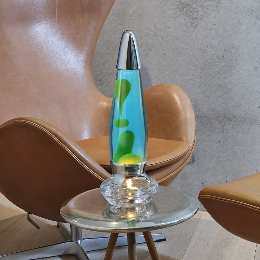 A chair with a Mathmos Candle Lava Lamp on it, worth £65.