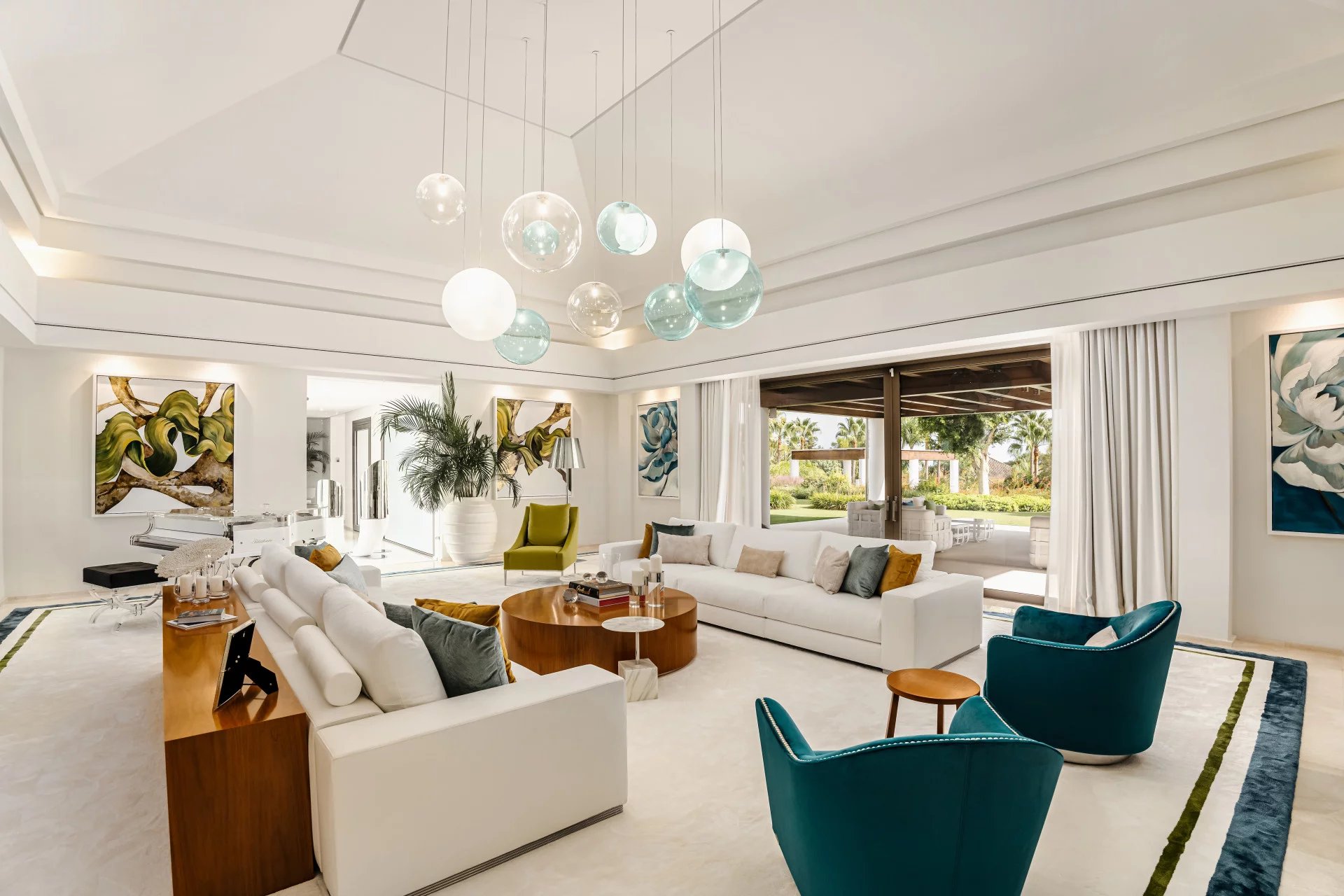 A holiday home on the Costa Del Sol with white furniture and blue accents.