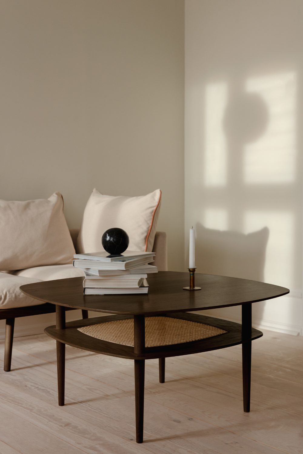 A cozy living room with a comfortable couch and a stylish coffee table, perfect for home projects or flipping through inspiring coffee table books.