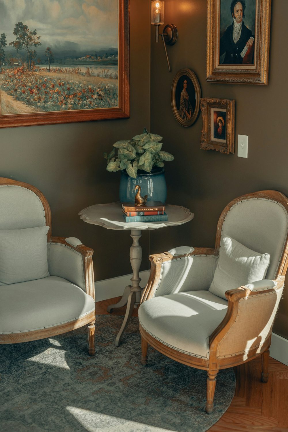 Two chairs in an older relative's house with a useful painting on the wall.