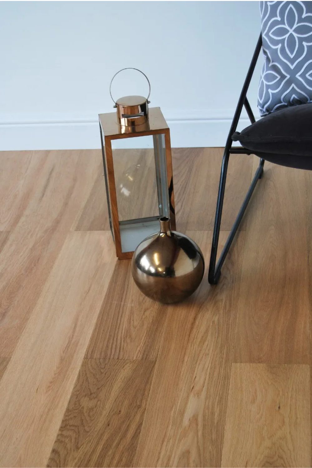 Light wooden floor with gold candle holders
