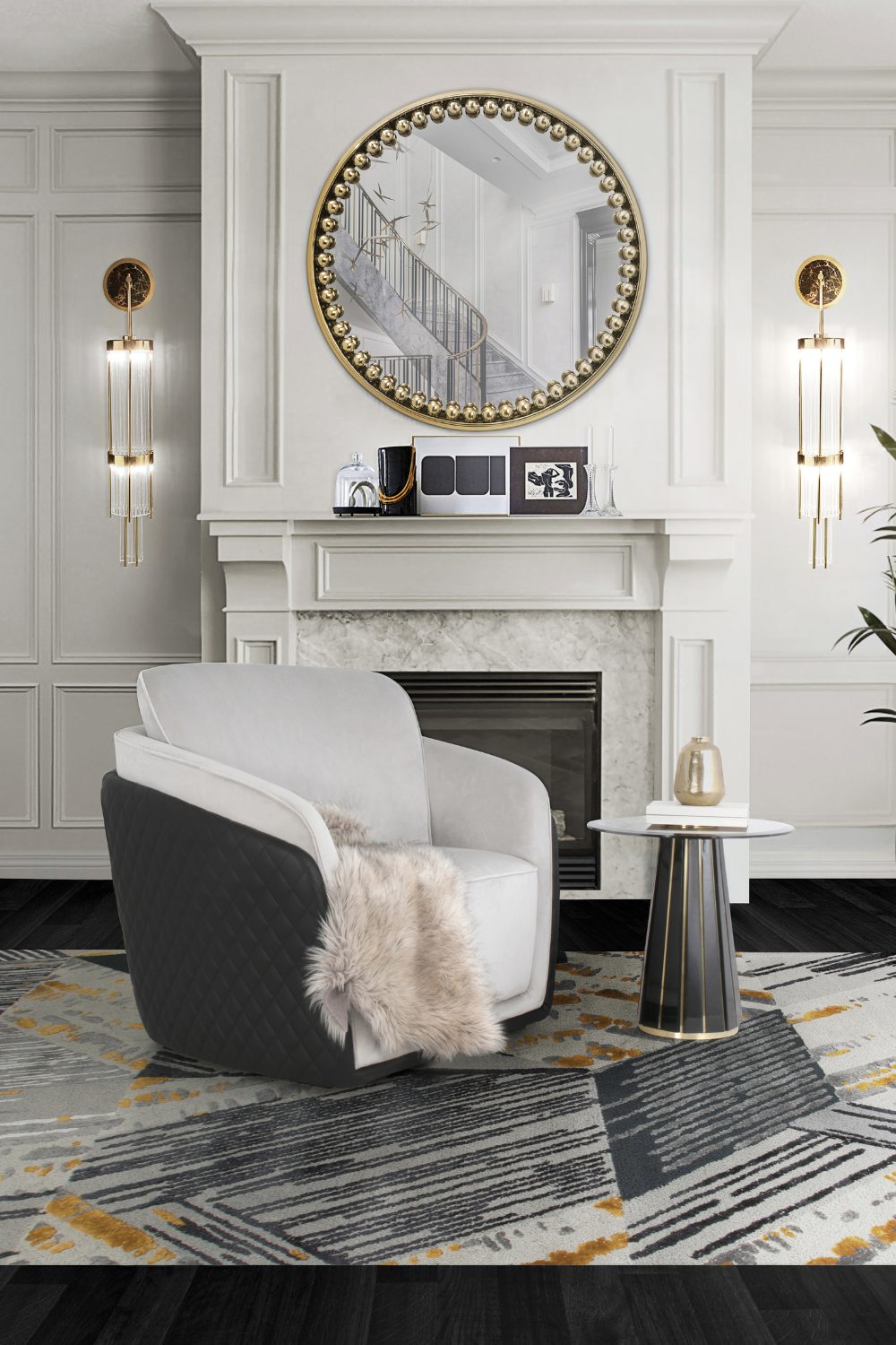 Grey armchair on patterned rug in white living room with black skirting boards