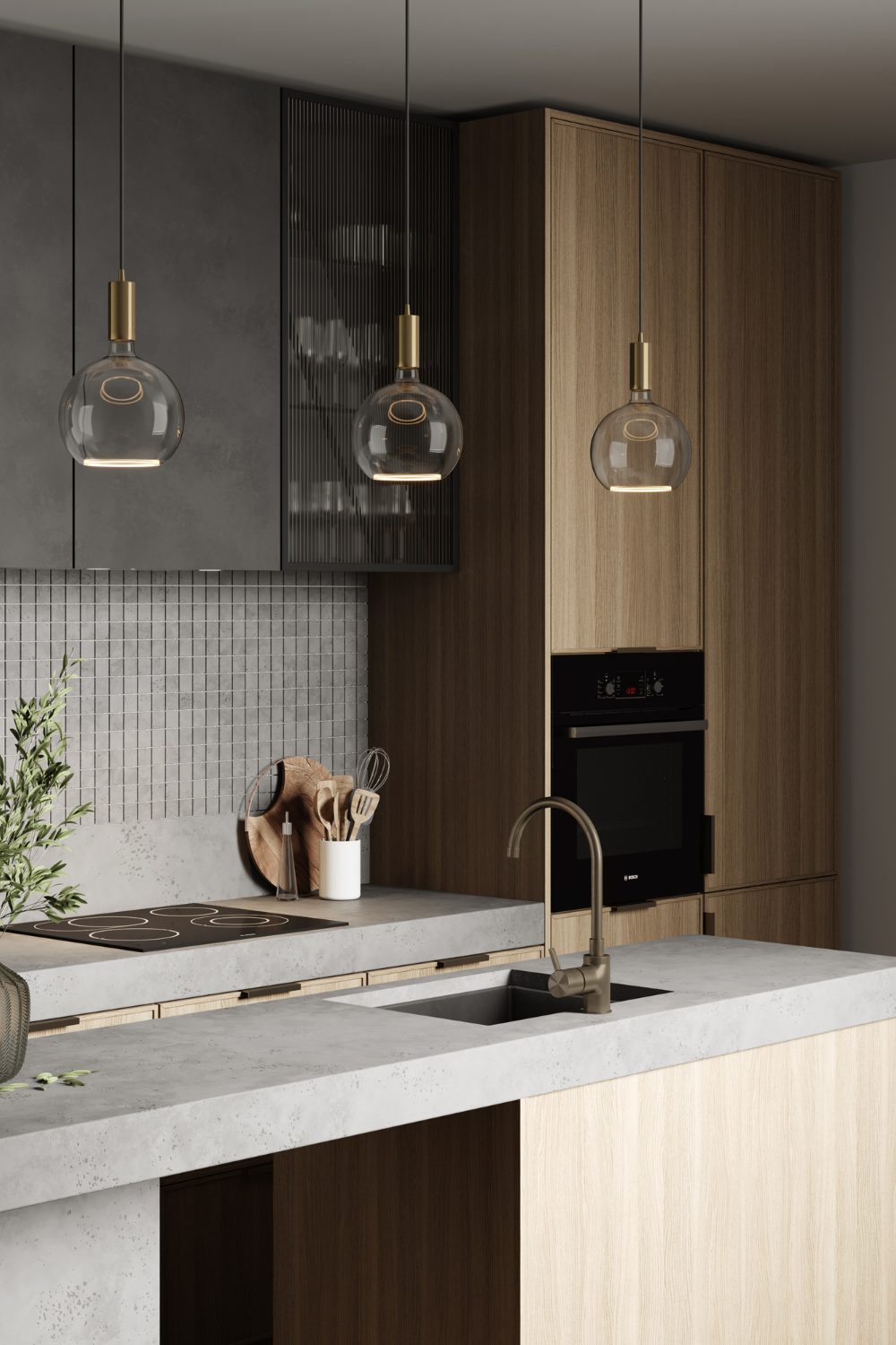 Three globe lights in grey kitchen with island, electric hob, grey and wooden cabinets