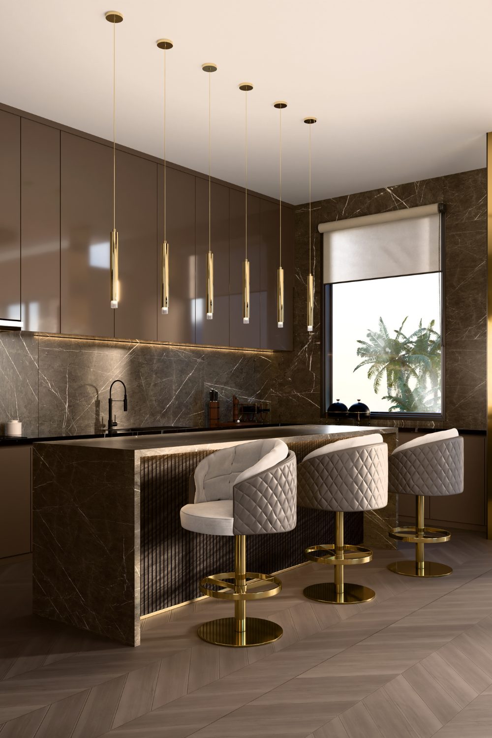 Brown kitchen with island, grey quilted chairs and hanging gold lights