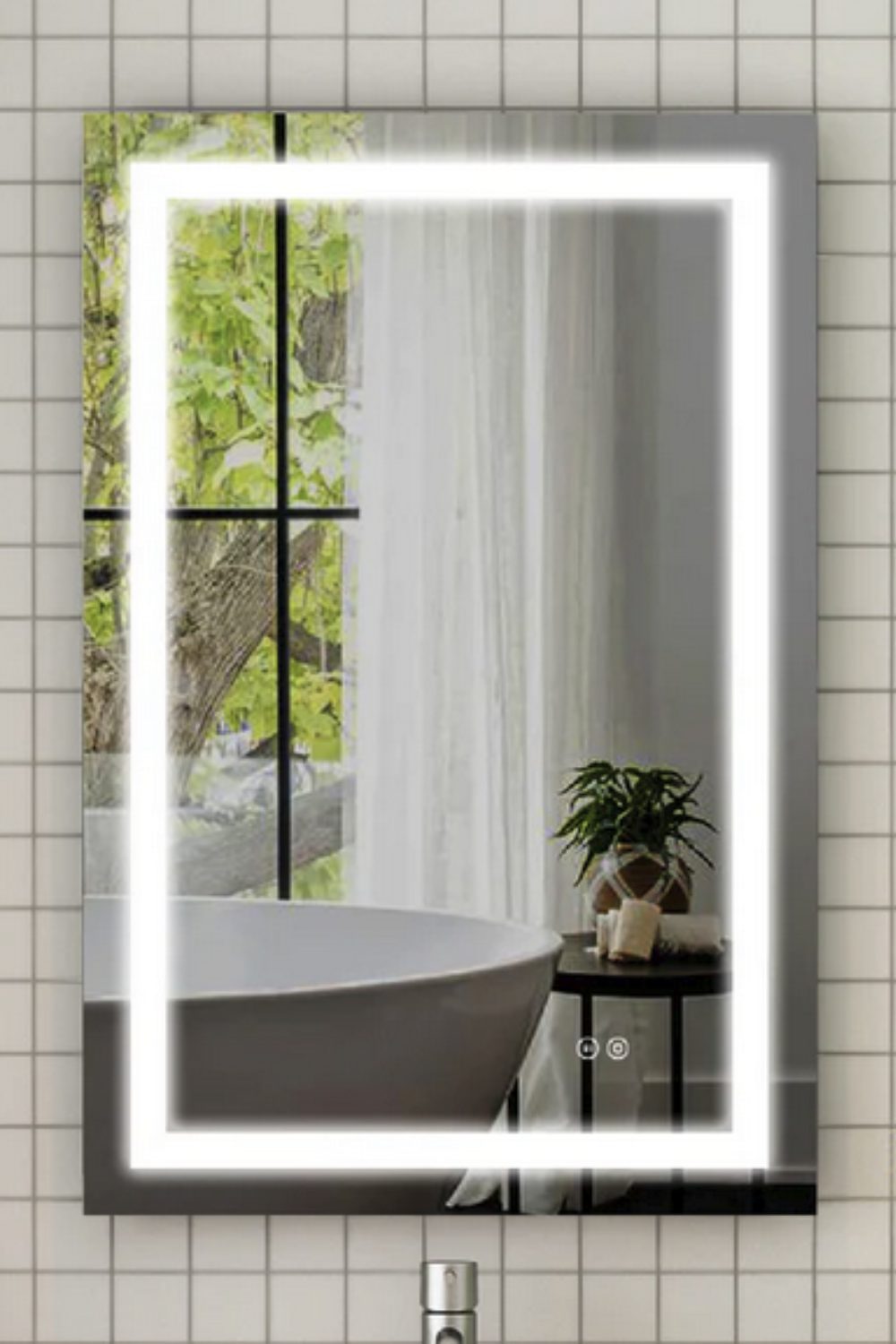 Rectangular mirror on a white tiled wall reflecting white bath in front of window