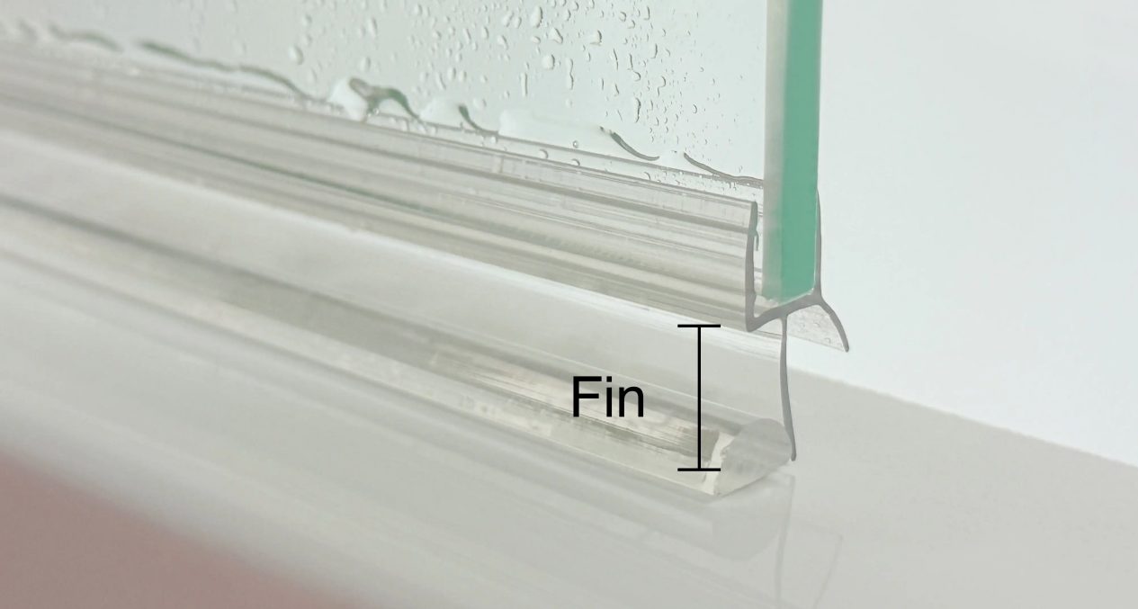 Diagram showing plastic barrier on bottom of glass shower door