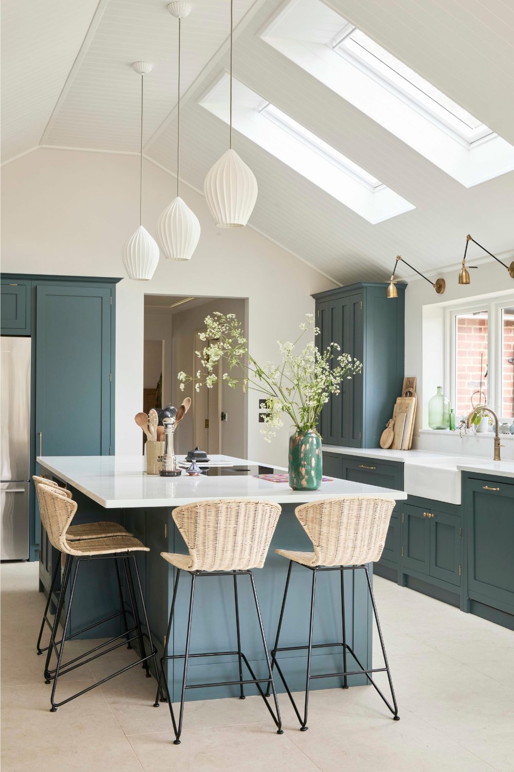 White kitchen with wooden floor and skylight