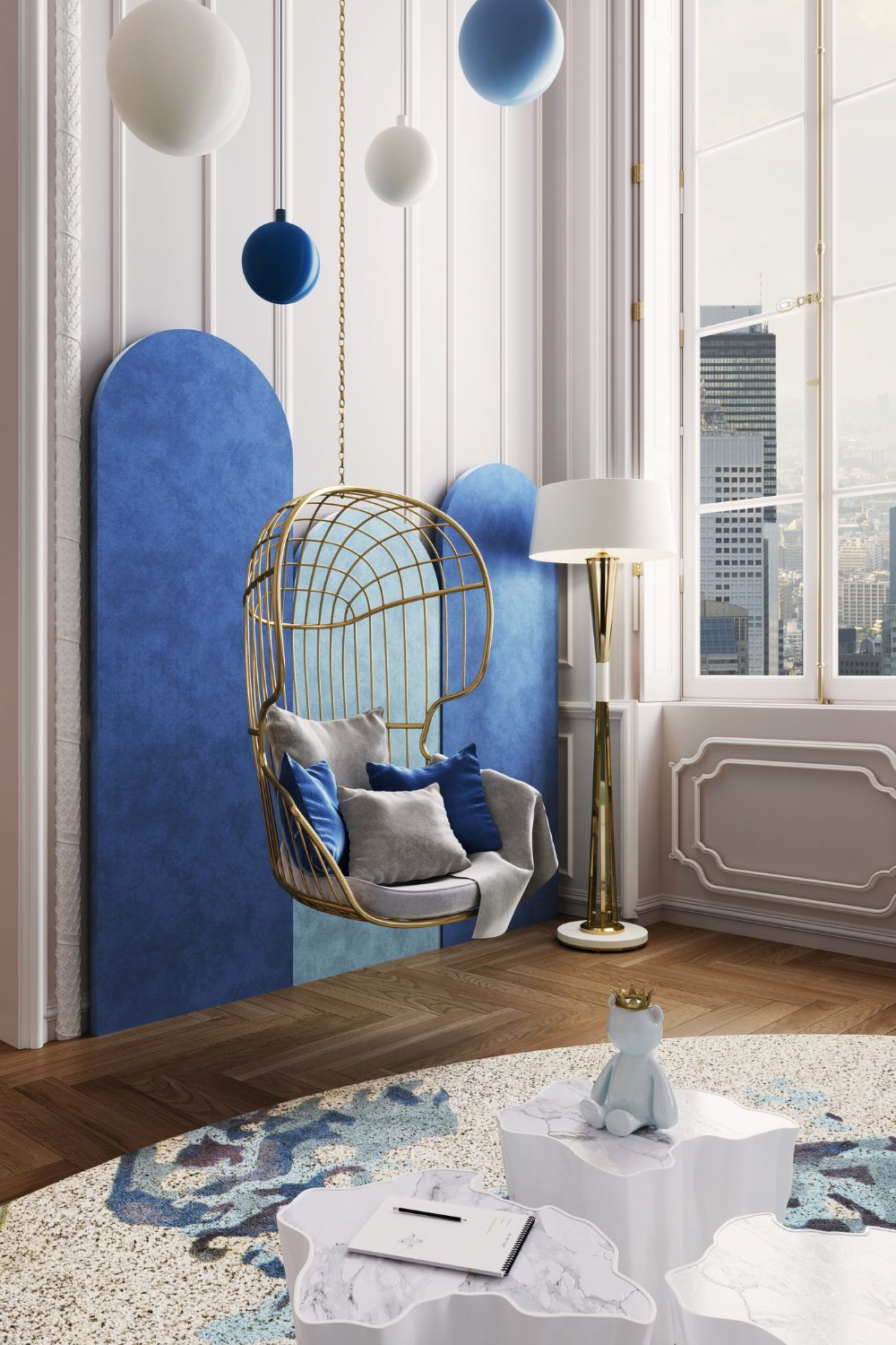 White living room with blue feature wall, gold hanging chair with blue & white cushions, circular blue & white rug and gold standing lamp