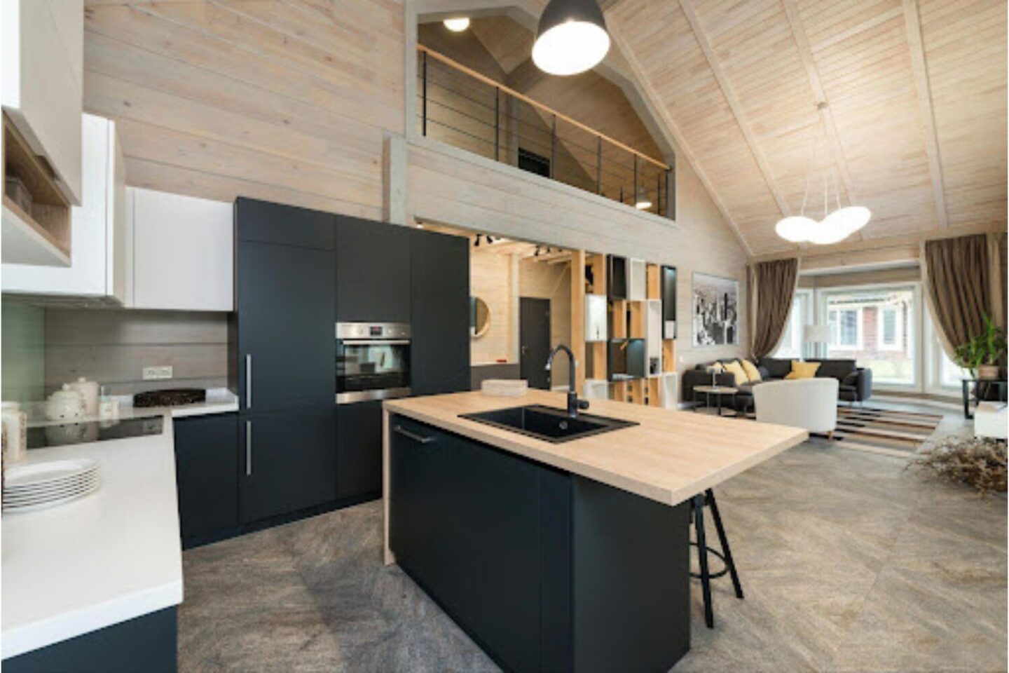 Light wood cabin with modern kitchen and living room, and mezzanine level with balcony