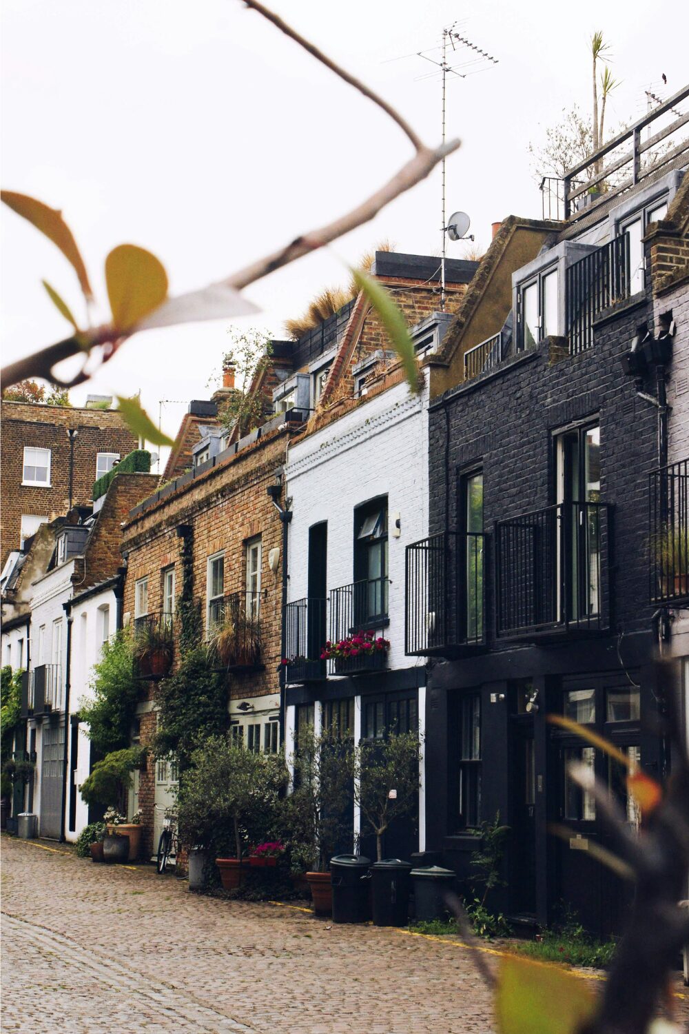 Smart brick terraced houses on cobbled street