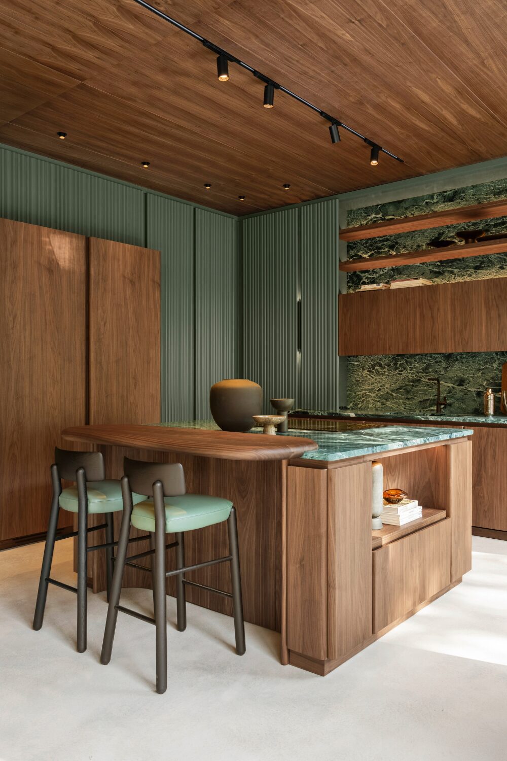 Wood and green marble kitchen with island and green & black stools