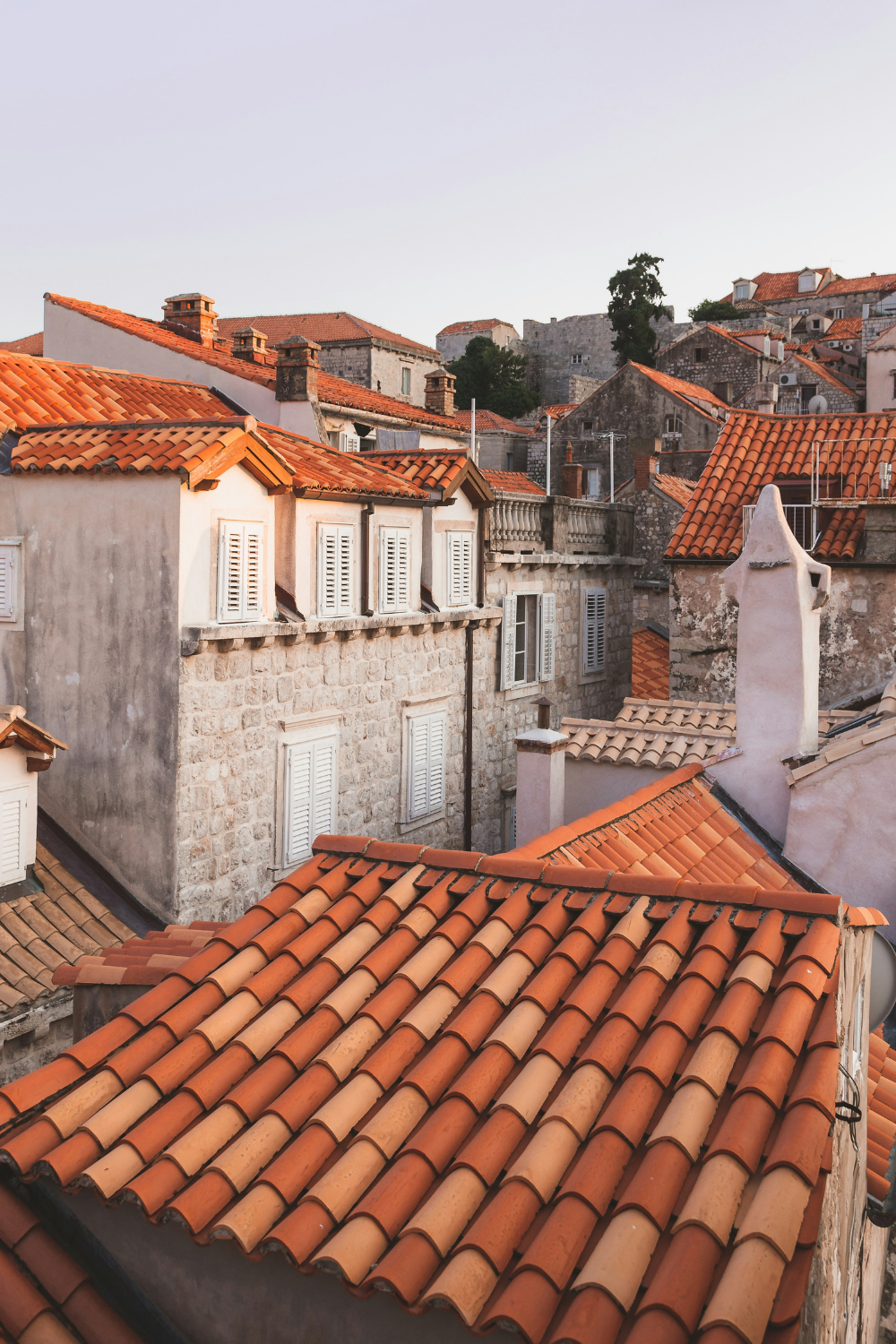 White stone houses with red tile roofs
