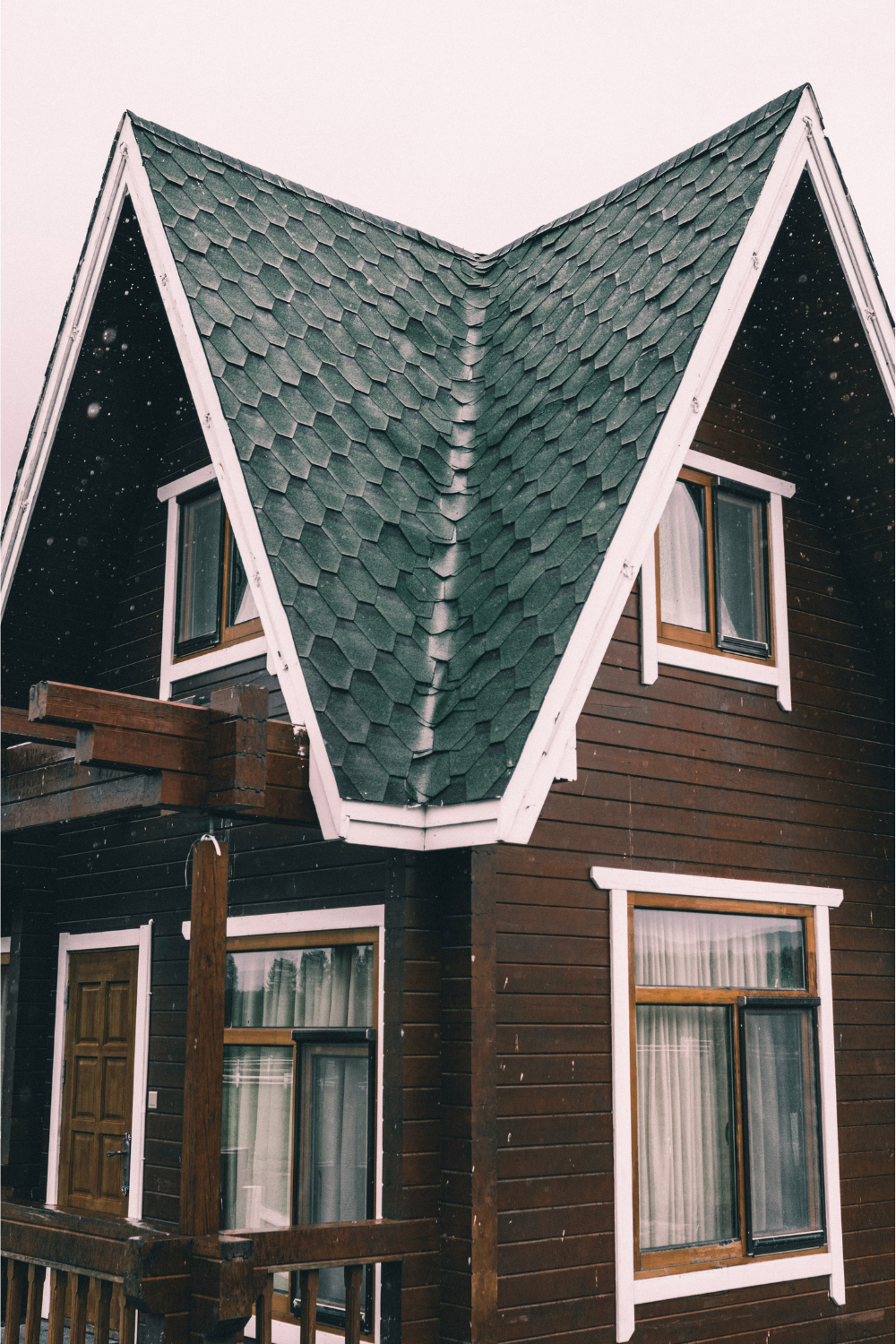 Wooden house with grey tiled roof
